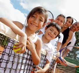 Family playing tennis